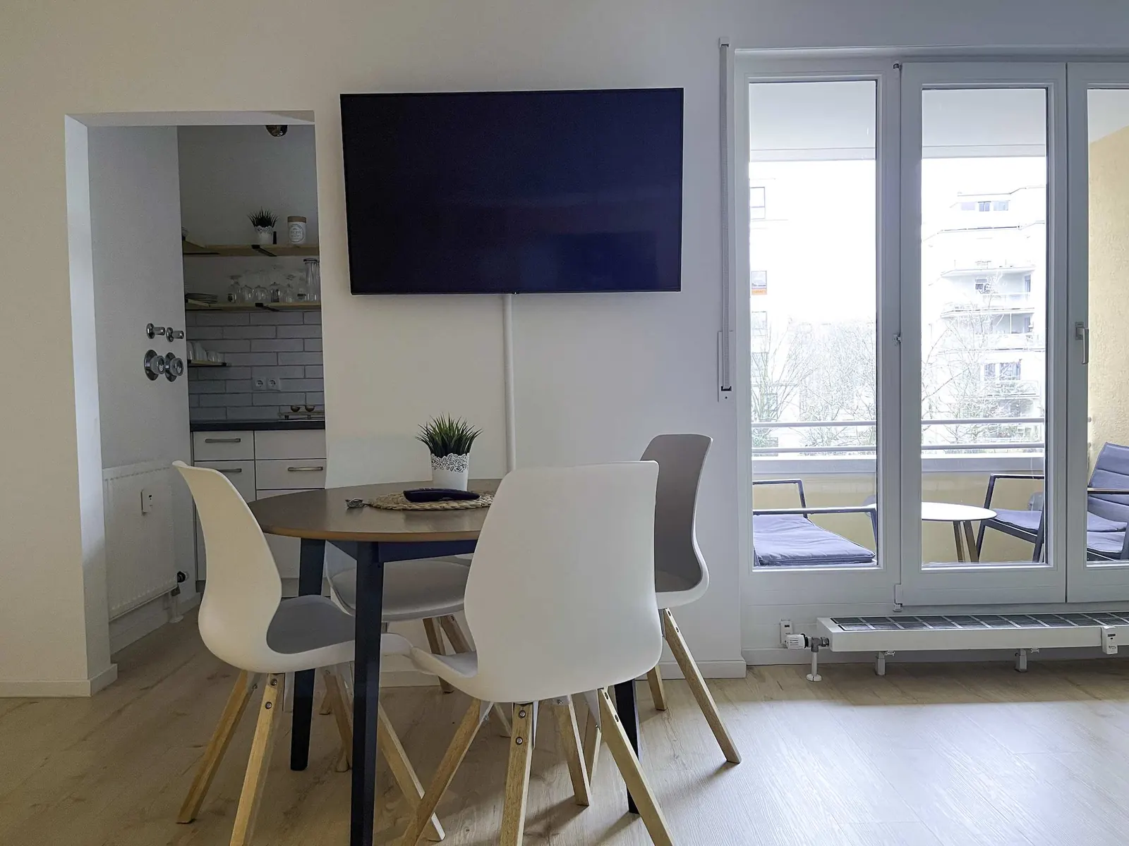 Living room with smart TV and balcony door